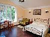 «Первый доходный дом» отель - предварительное фото Семейная комната De Luxe с двуспальной кроватью и диваном (литер 
