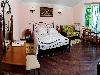 «Первый доходный дом» отель - предварительное фото Семейная комната De Luxe с двуспальной кроватью и диваном (литер 